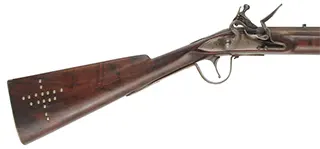 Northwest Trade Gun,
20 gauge, 32" tapered octagon-to-round barrel,
L&R flintlock, walnut, brass & iron, tacks, used Northwest Trade Gun,
20 gauge, 32" tapered octagon-to-round barrel,
L&R flintlock, walnut, brass & iron, tacks, used